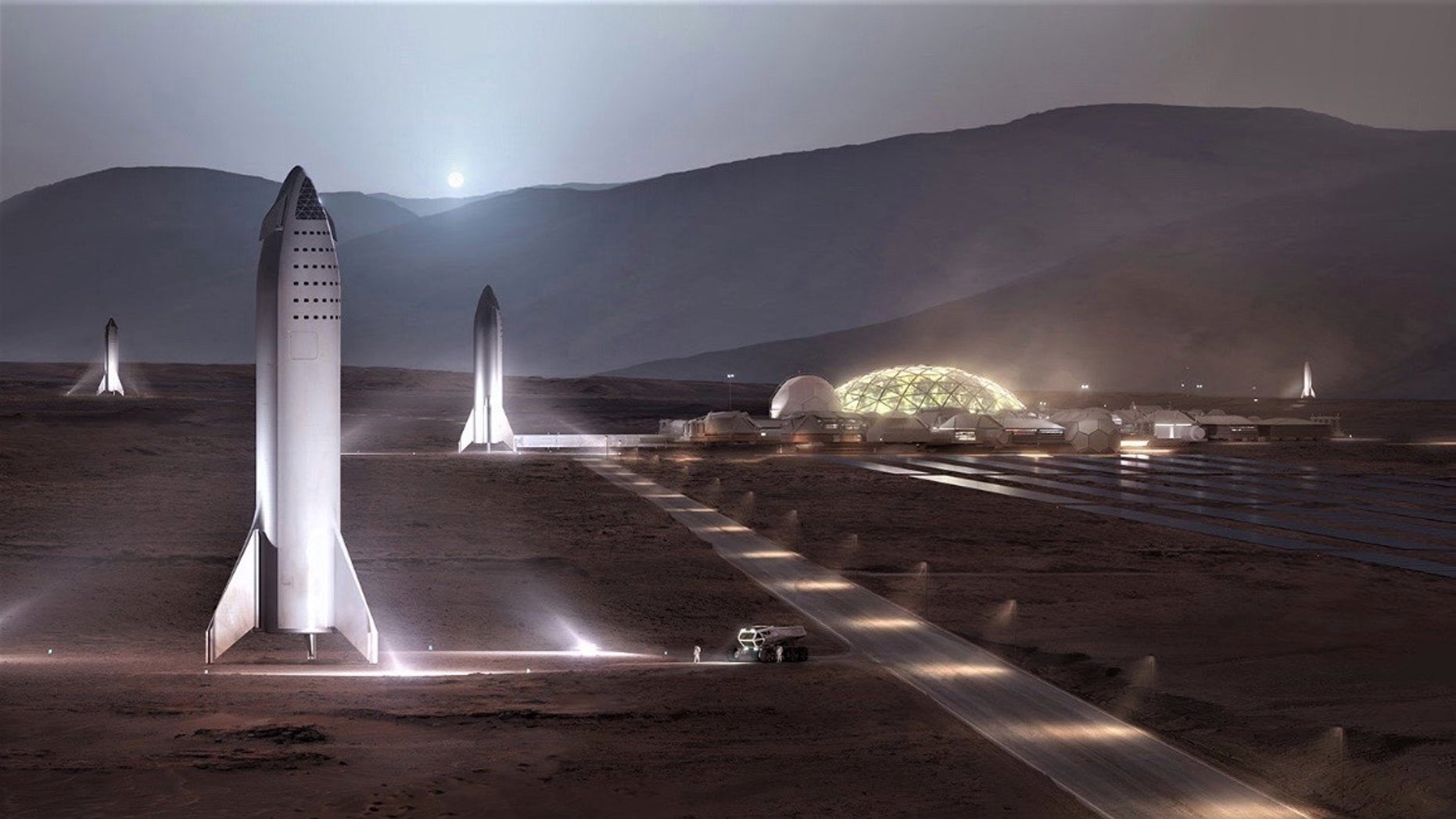 An artist's illustration showing SpaceX BFR spaceships standing at the Red Planet outpost "Mars Base Alpha."