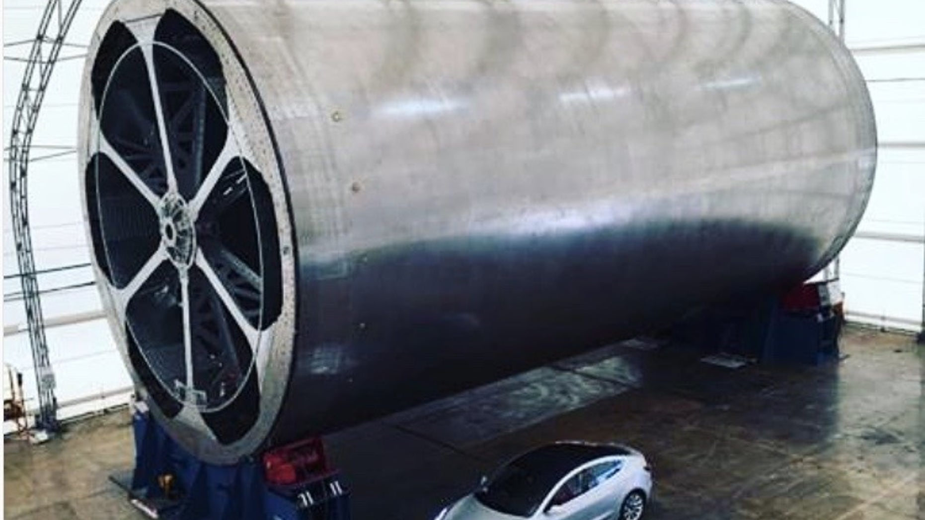 SpaceX founder and CEO Elon Musk posted this photo on Instagram on April 8, 2018. It shows "the main body tool" for the company's Mars-colonizing BFR spaceship, along with a Tesla car for scale.