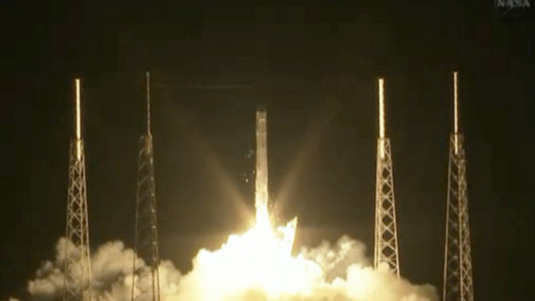 SpaceX's unmanned Dragon capsule launches toward the International Space Station on the first-ever bona fide cargo run for a private American spaceship.