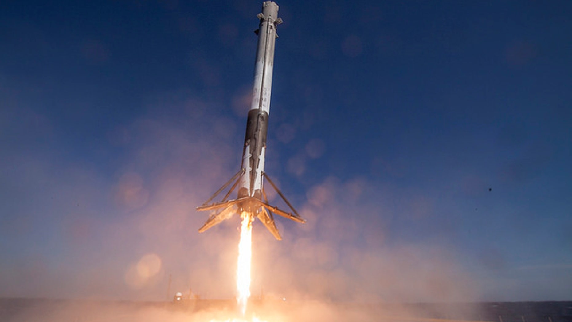 The first stage of SpaceX's Falcon 9 rocket lands on the deck of the robotic ship "Of Course I Still Love You" on April 8, 2016 (Credit: SpaceX)