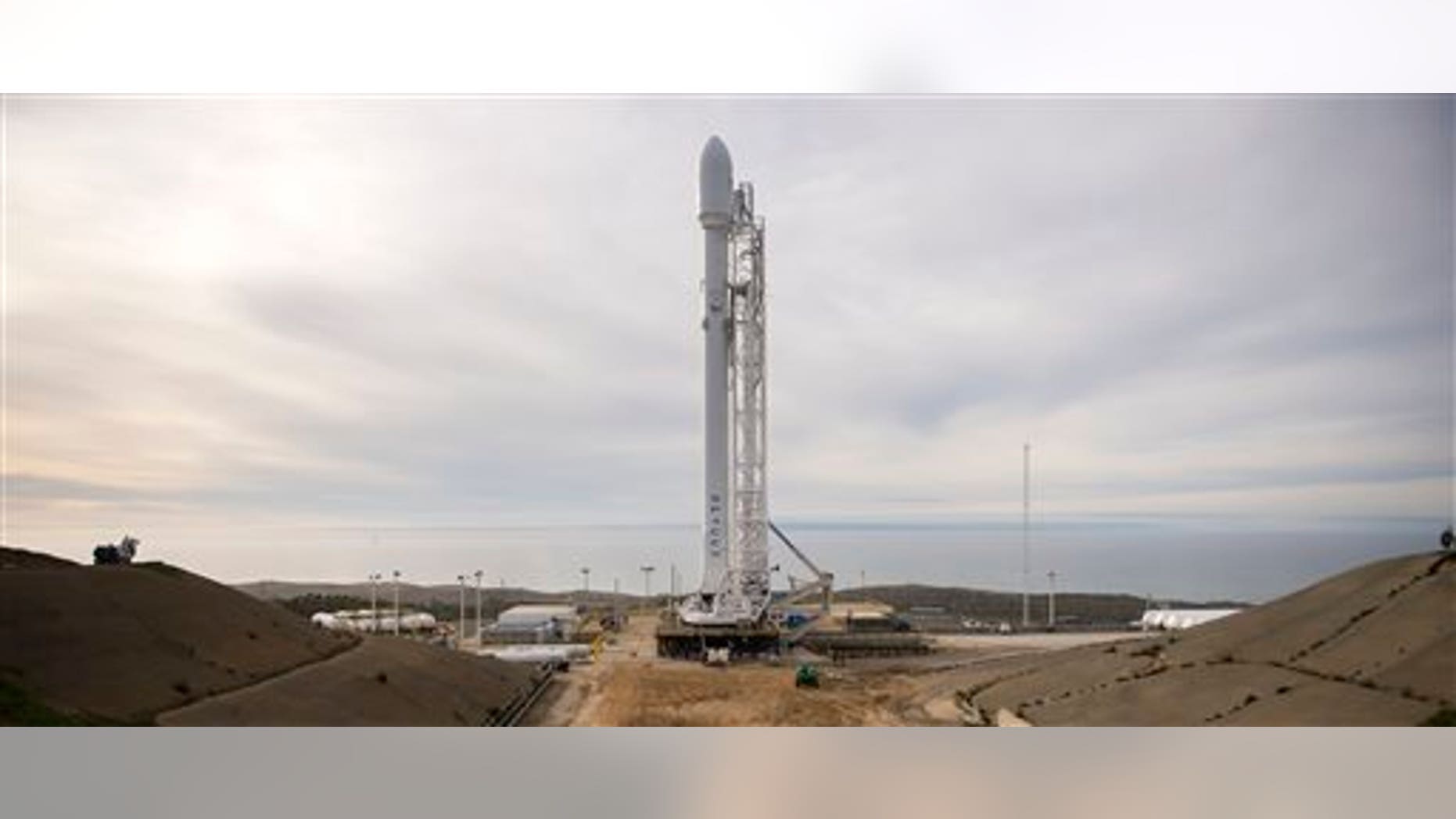 The SpaceX Falcon 9 rocket is seen at Vandenberg Air Force Base Space Launch Complex 4 East with the Jason-3 spacecraft onboard, Saturday, Jan. 16, 2016, in California. (Bill Ingalls/NASA via AP)
