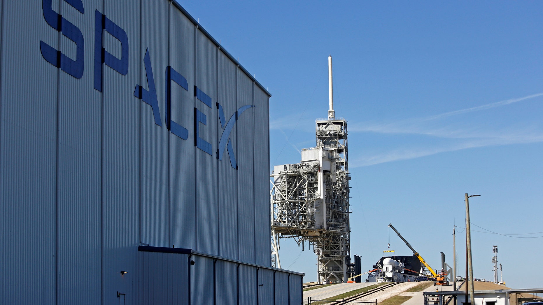 File photo -A SpaceX Falcon 9 rocket (in center, in a horizontal position), is readied for launch on a supply mission to the International Space Station on historic launch pad 39A at the Kennedy Space Center in Cape Canaveral, Florida, U.S., February 17, 2017. (REUTERS/Joe Skipper)