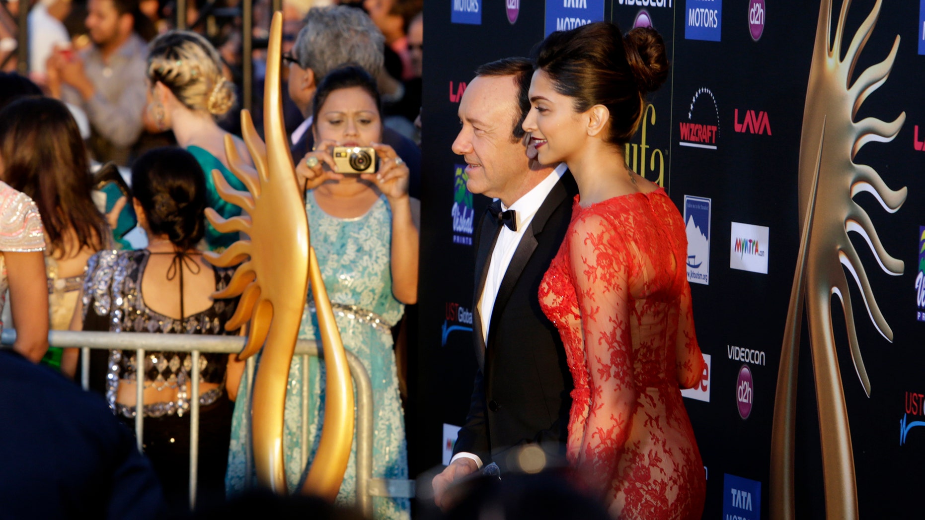 April 26, 2014. Kevin Spacey poses with Deepika Padukone on the green carpet at Raymond James stadium for the 15th International Indian Film Academy Awards in Tampa, Fla.