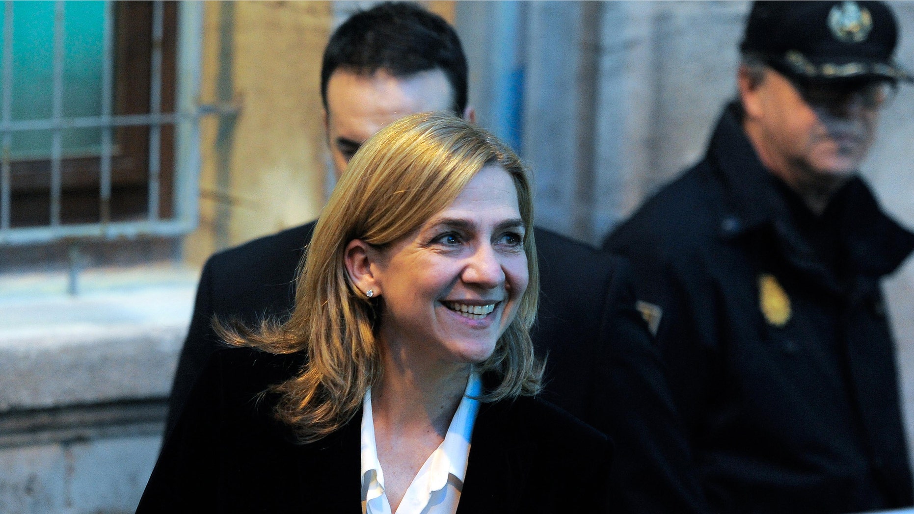 PALMA DE MALLORCA, SPAIN - FEBRUARY 08: Princess Cristina of Spain leaves the Palma de Mallorca Couthouse after giving evidence during the 'Noos Trial' on February 8, 2014 in Palma de Mallorca, Spain. Princess Cristina of Spain will gives evidence as part of the trial against her husband Inaki Urdangarin over allegations that he misused millions of euros of public funds which was allocated to organise sports and tourism events, during his time as chairman of a non-profit foundation from 2004 to 2006. (Photo by David Ramos/Getty Images)