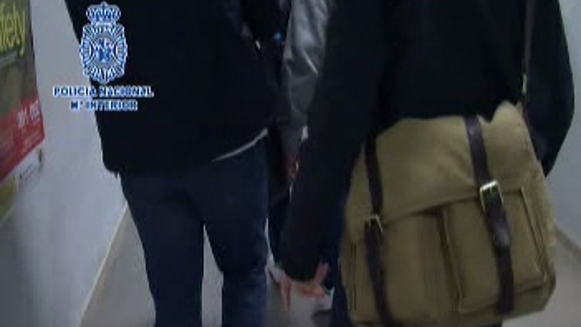 Spanish National Police released footage of the extradition without showing the suspect's face.
