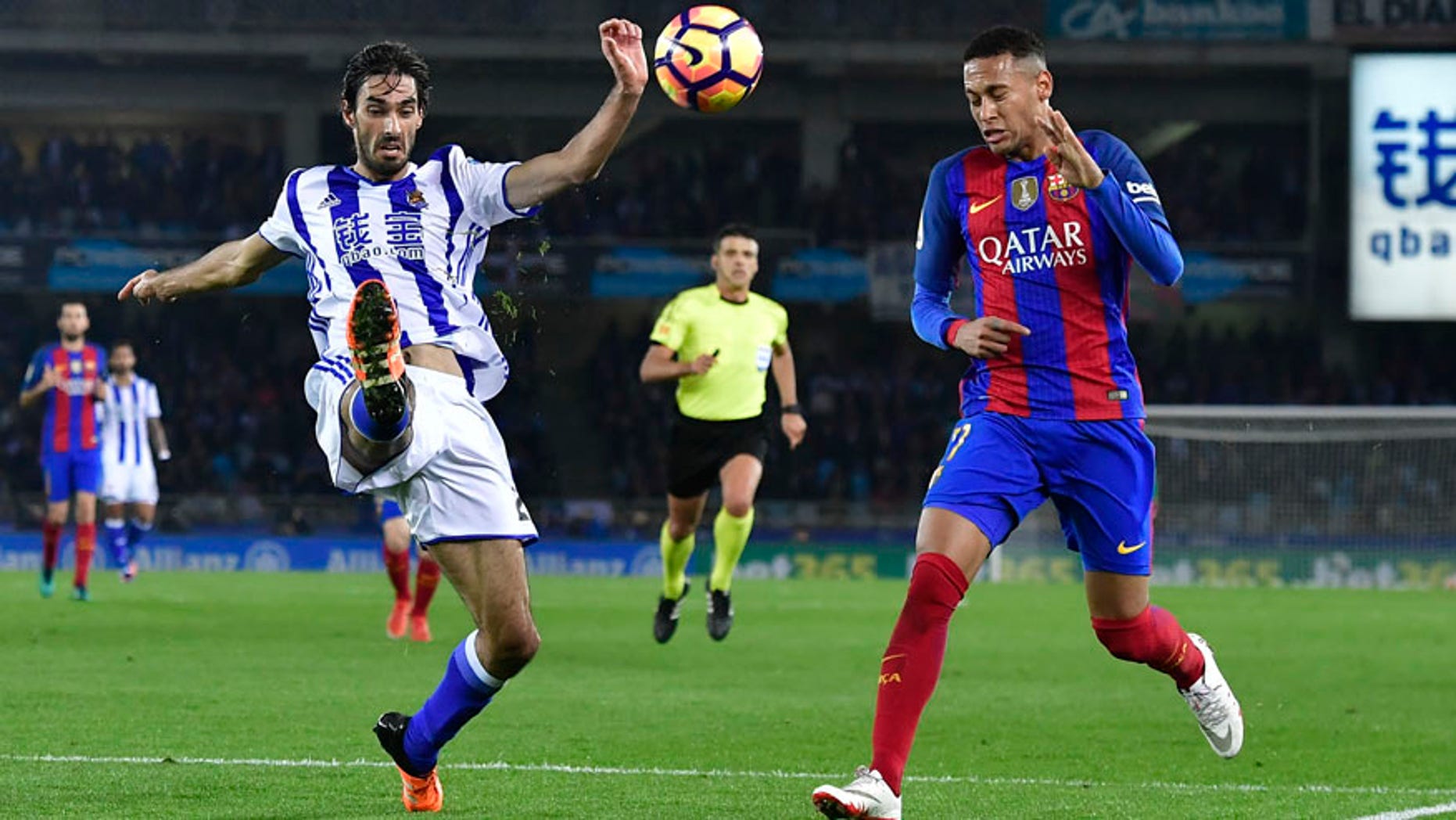 FC Barcelona's Neymar Jr., right, duels for the ball with Real Sociedad's Carlos Martinez during the Spanish La Liga soccer match between FC Barcelona and Real Sociedad, at Anoeta stadium in San Sebastian, northern Spain, Sunday, Nov. 27, 2016. (AP Photo/Alvaro Barrientos)