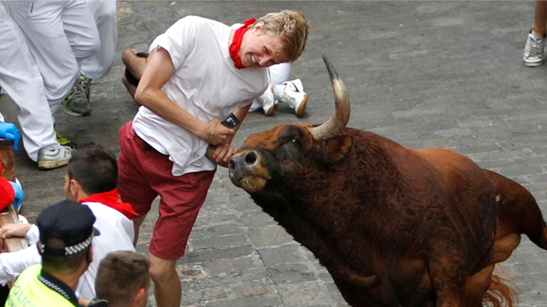 Patrick Eccles, a junior at the University of Utah, is gored by a fighting bull during the running of the bulls at the San Fermin festival.