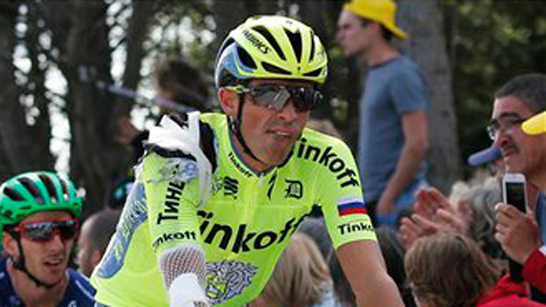 Spain's Alberto Contador crosses the finish line after crashing in the first stage of the Tour de France cycling race over 188 kilometers (116.8 miles) with start in Mont-Saint-Michel and finish in Utah Beach, France, Saturday, July 2, 2016. (AP Photo/Christophe Ena)