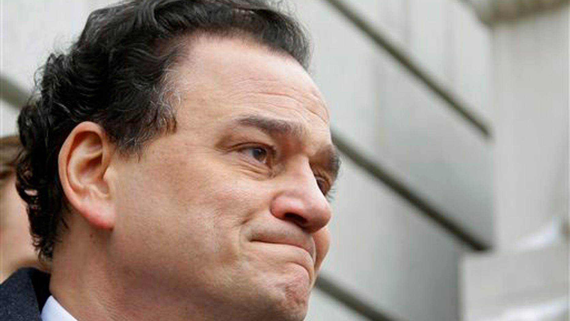 Former Rhode Island House Speaker Gordon Fox begins to tear-up as he stands on the steps of the Federal Courthouse speaking to members of the media after his initial appearance and plea hearing in front of a federal judge.