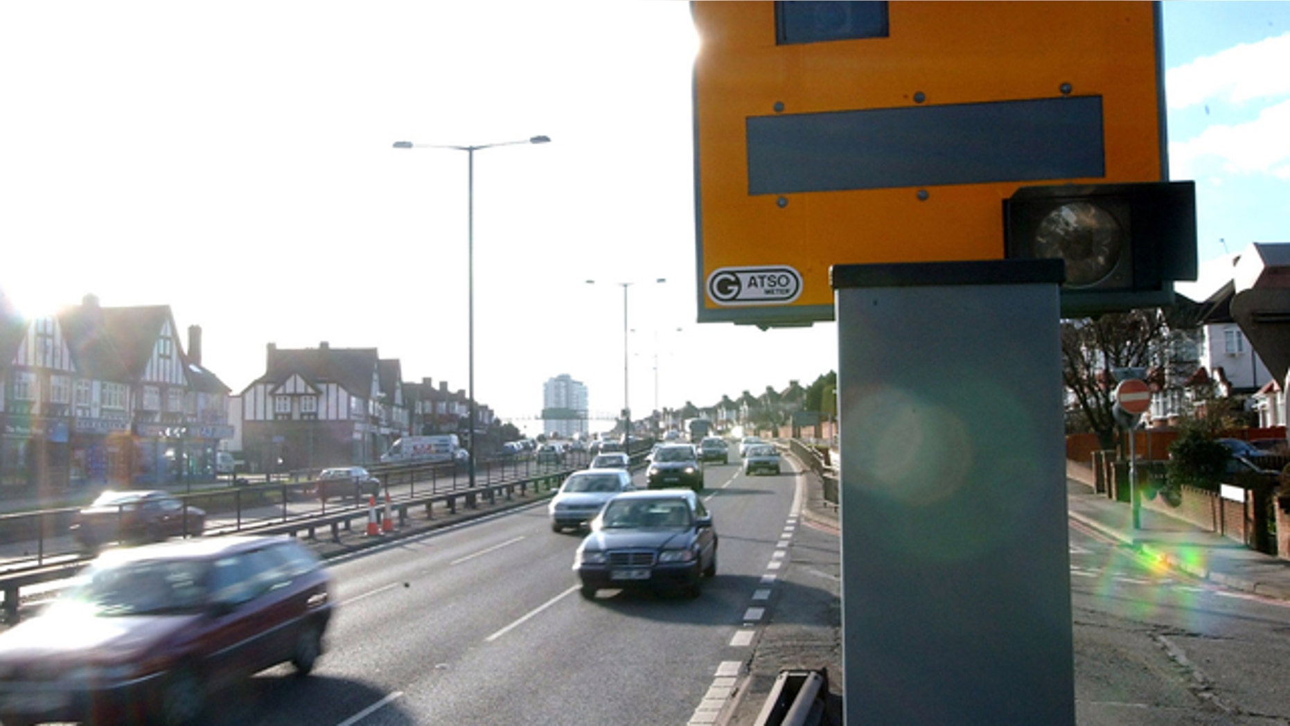 A speed camera watches over a highway in England.