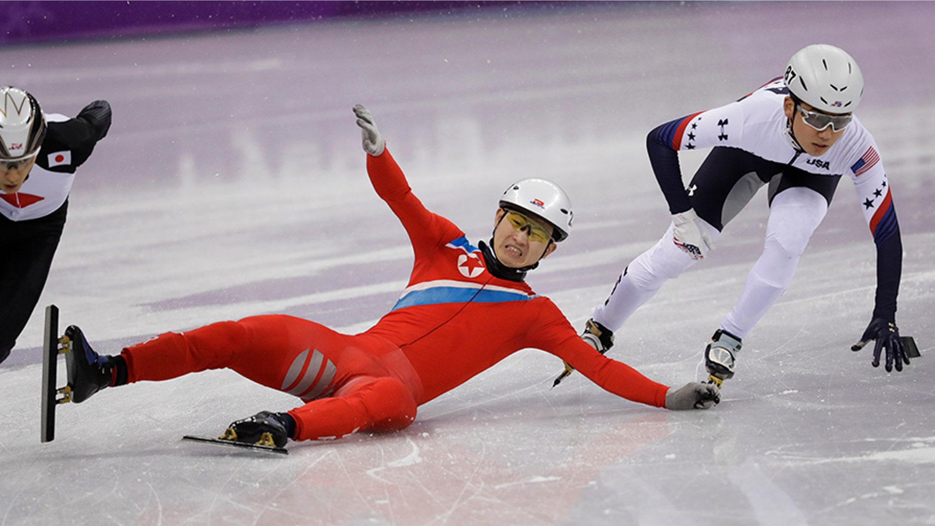 Jong Kwang Bom of North Korea crashes during their men's 500 meters short track speedskating heat in the Gangneung Ice Arena at the 2018 Winter Olympics in Gangneung, South Korea on Tuesday.