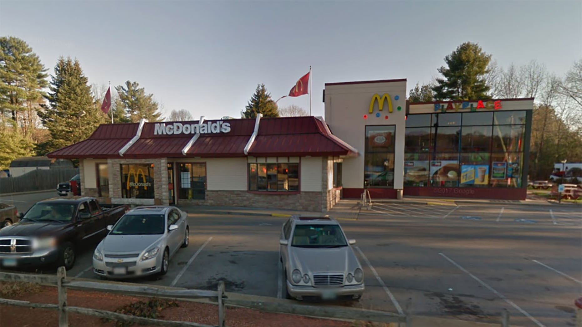 Firefighters responded to McDonald's in Massachusetts after a young girl became stuck in the playground equipment.