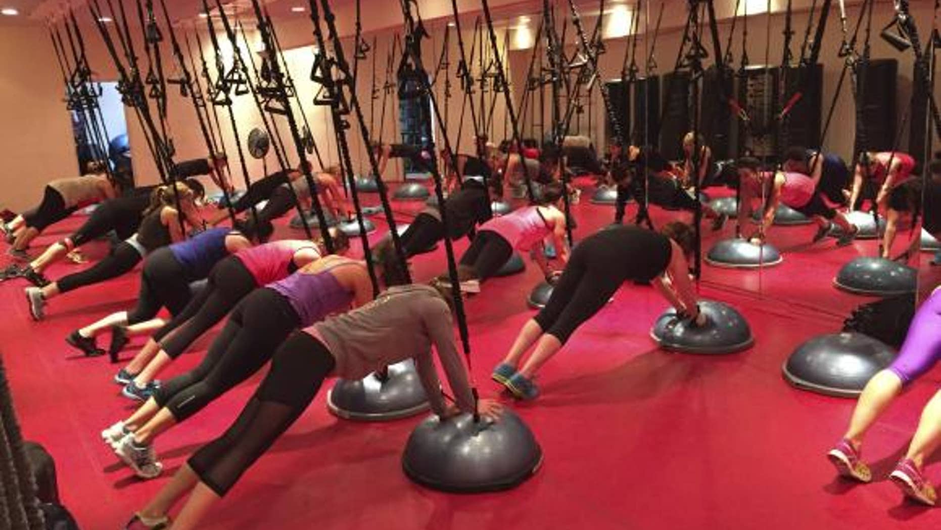 Participants work out during a Spiderband fitness class in a handout picture taken at Fuel Fitness in Brooklyn, New York, in October, 2014.