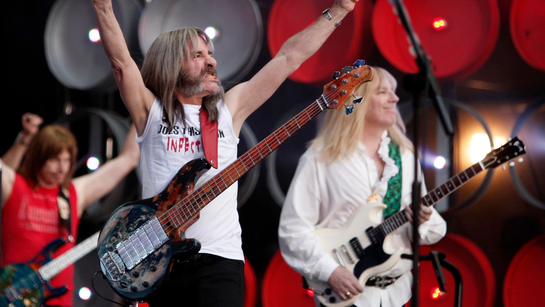 (L-R) Nigel Tufnel (played by Christopher Guest), Derek Smalls (played by Harry Shearer), and David St. Hubbins (played by Michael McKean) of Spinal Tap perform during the Live Earth concert at Wembley Stadium in London, July 7, 2007. Former U.S. Vice President Al Gore and his global partners are staging the Live Earth concerts held on seven continents simultaneously to raise awareness of environmental issues. REUTERS/Stephen Hird (BRITAIN) - RTR1RKT1