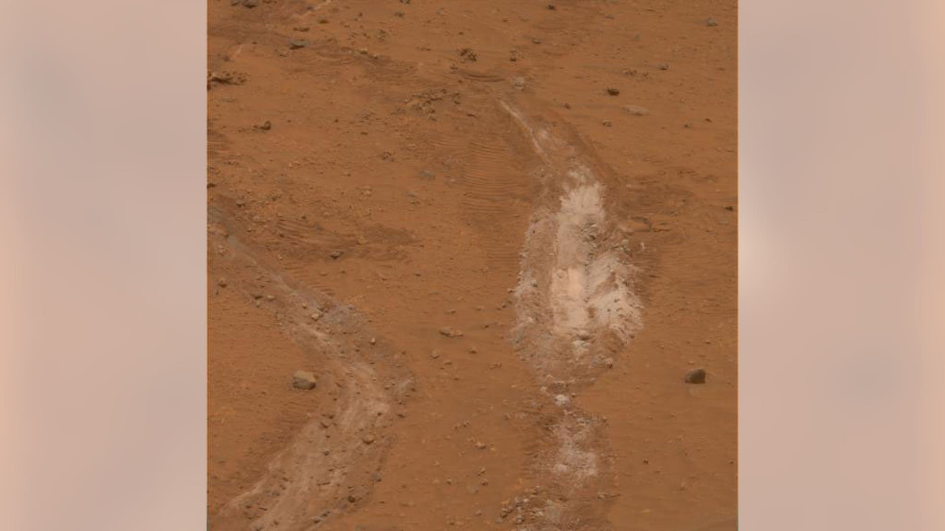 The jammed front wheel of NASA’s Spirit rover dug this trench inside Mars’ Gusev Crater in 2008. Spirit’s observations allowed researchers to determine that the white material is evidence of an ancient hydrothermal system on the Red Planet.