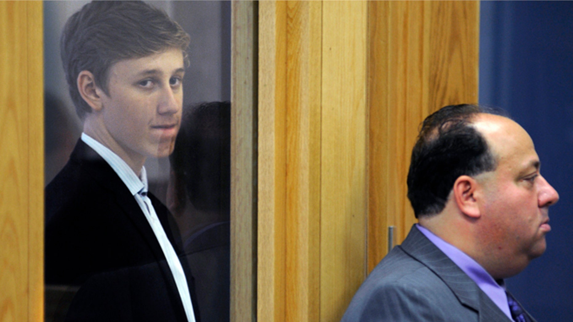 Sept. 3: Galileo Mondol, 17, left, stands with his attorney William A. Korman, right, during his arraignment at Central Berkshire District Court in Pittsfield, Mass. Mondol is charged with sexually assaulting three younger students at Camp Lenox on Aug. 25 in Otis, Mass., during a Somerville High School team-building retreat for the soccer team. )