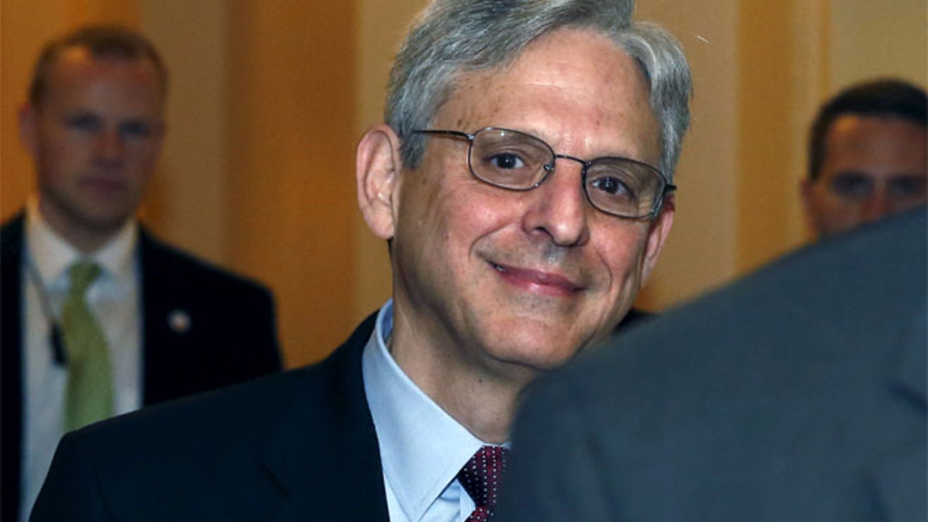 FILE; Judge Merrick Garland walks after a breakfast with Senate Judiciary Committee Chair Senator Chuck Grassley.