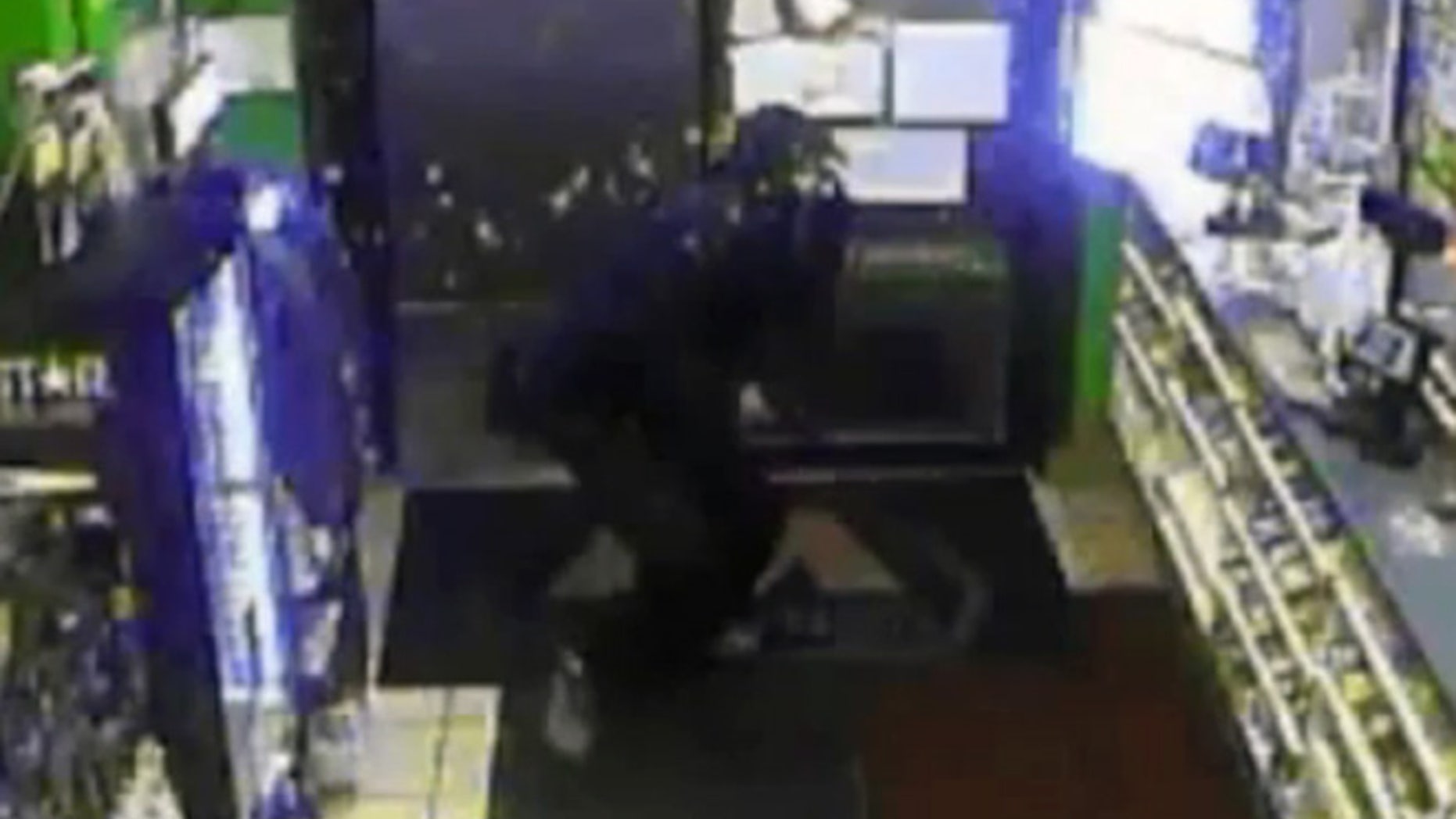 An armed robbery suspect was splashed in the face with hot coffee Sunday at a gas station in Muncie, Ind.