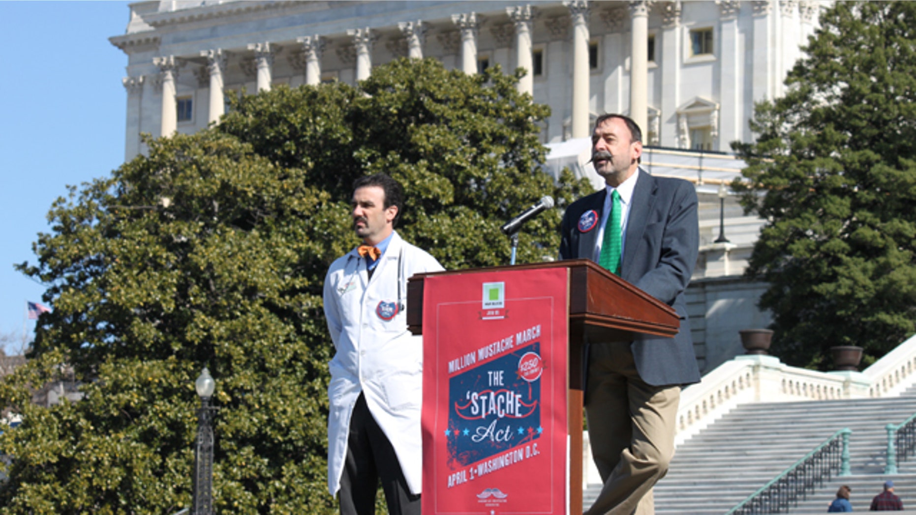 Feb. 20, 2012: Aaron Perlut, left, chairman of the American Mustache Institute, and John Yeutter of Northeastern State University promote a proposal to give a $250 tax refund to mustached Americans.