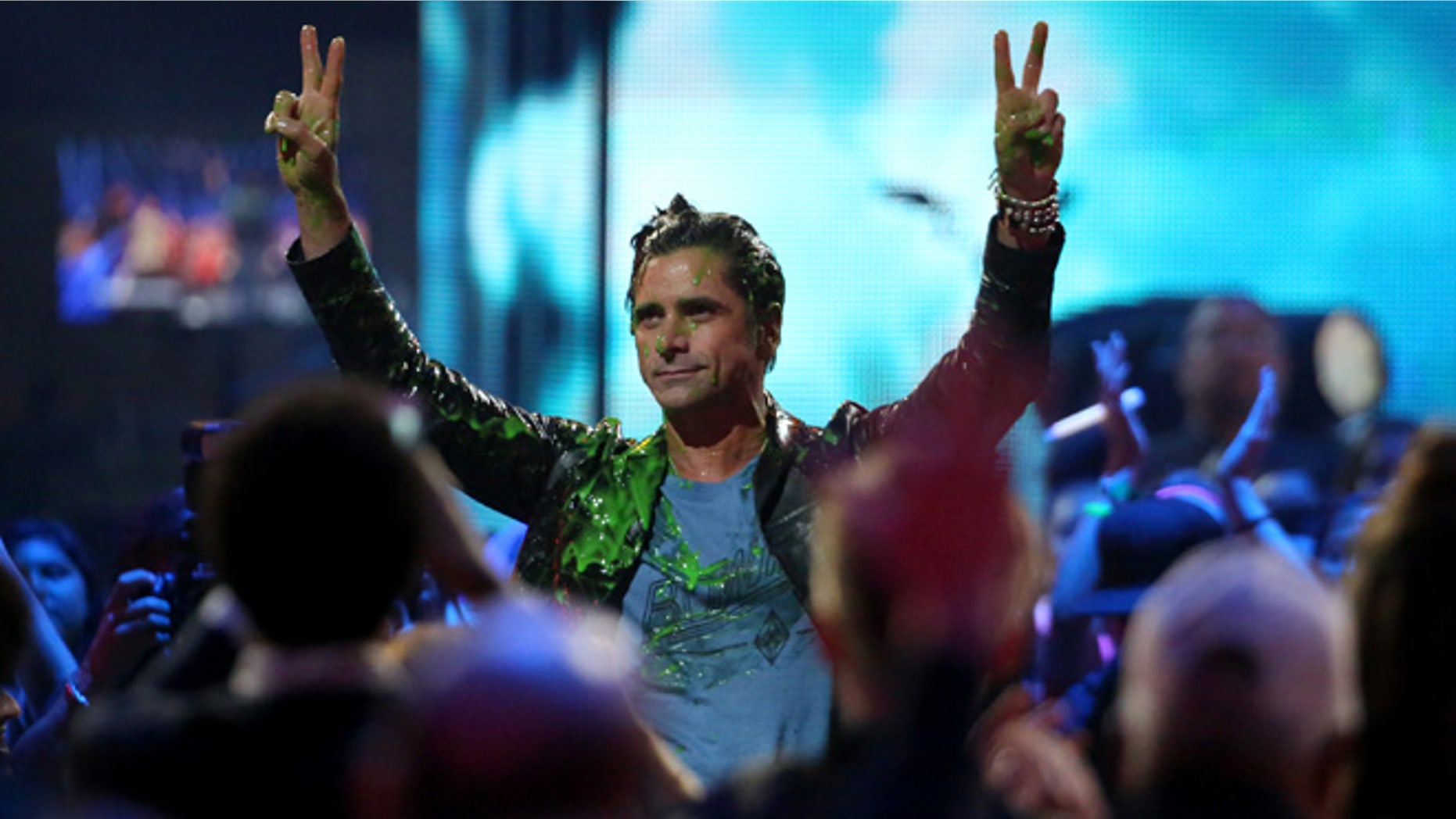 March 12, 2016. John Stamos gets slimed at the Kids' Choice Awards at The Forum on Saturday, March 12, 2016, in Inglewood, Calif.