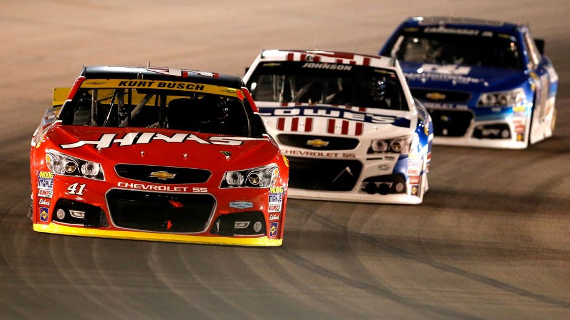 AVONDALE, AZ - NOVEMBER 15: Kurt Busch, driver of the #41 Haas Automation Chevrolet, races Jimmie Johnson, driver of the #48 Lowe's Patriotic Chevrolet, and Dale Earnhardt Jr., driver of the #88 Nationwide Chevrolet, during the NASCAR Sprint Cup Series Quicken Loans Race for Heroes 500 at Phoenix International Raceway on November 15, 2015 in Avondale, Arizona. (Photo by Christian Petersen/Getty Images)