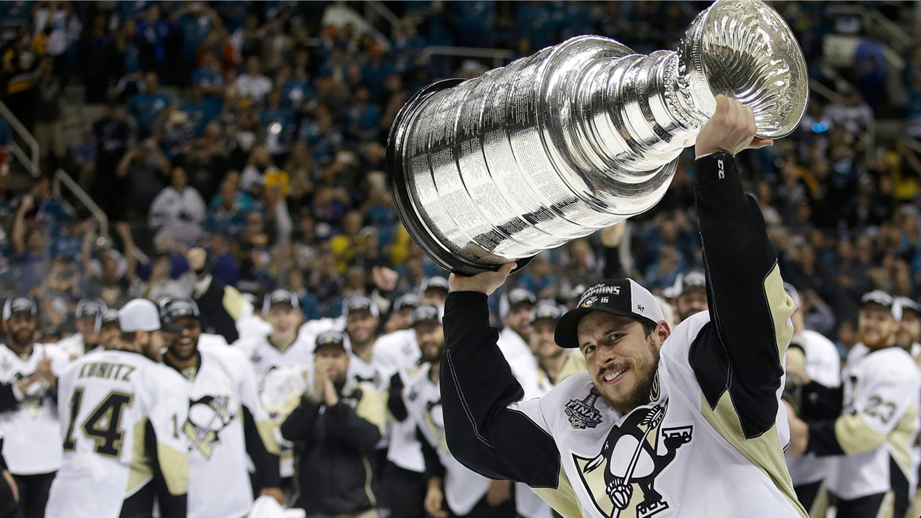 June 12, 2016: Pittsburgh Penguins center Sidney Crosby raises the Stanley Cup after Game 6 of the Stanley Cup Final against the San Jose Sharks.