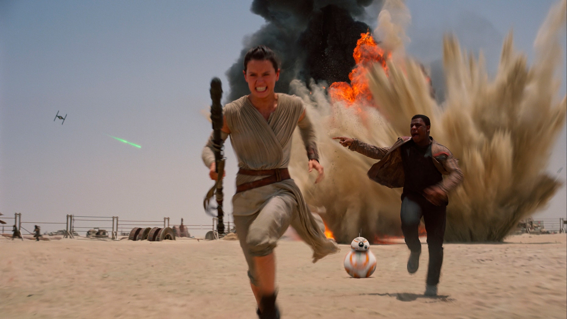 Daisey Ridley as Rey, left, and John Boyega as Finn, in a scene from the new film, 'Star Wars: Episode VII - The Force Awakens."