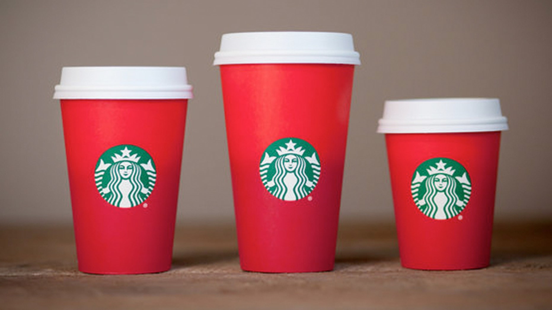 Starbucks' new holiday cup is has a simple red design devoid of the regular designs.