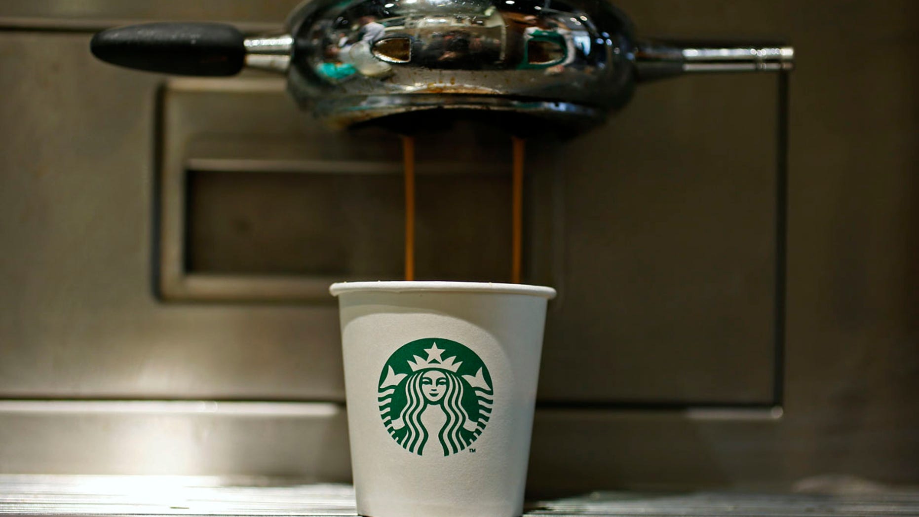 A paper cup is seen in a Starbucks Vigo Street branch in central London.