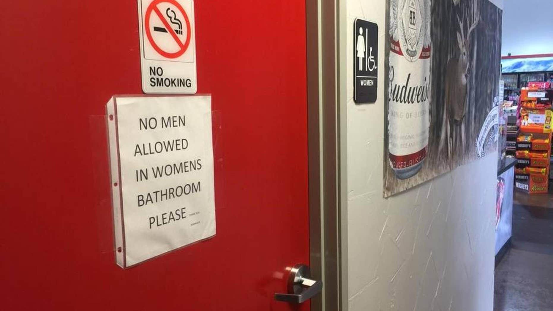 Sign on women's restroom door at BBQ on the Brazos restaurant in Texas.