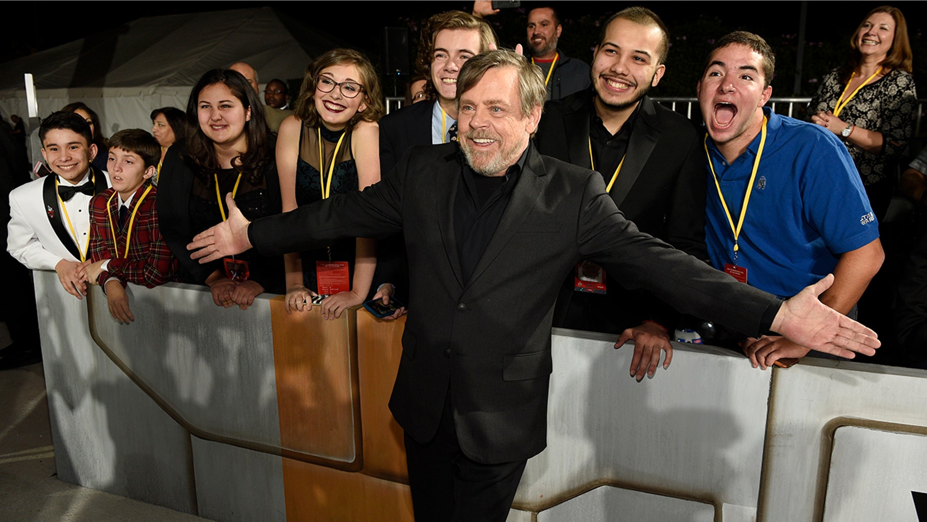 "Star Wars: The Last Jedi" cast member Mark Hamill poses with special guests at the premiere as part of the Make-A-Wish Foundation.