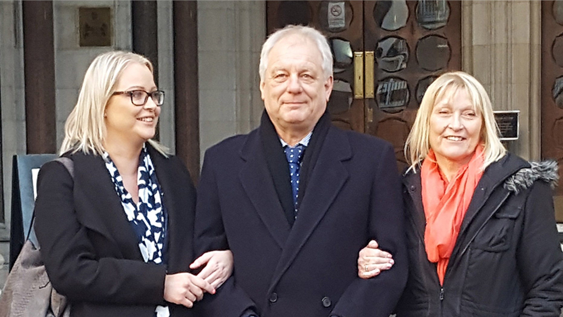 Stephen Simmons, center, was overjoyed in court Wednesday after his theft conviction from the 1970s was overturned by the United Kingdom's Court of Appeals.