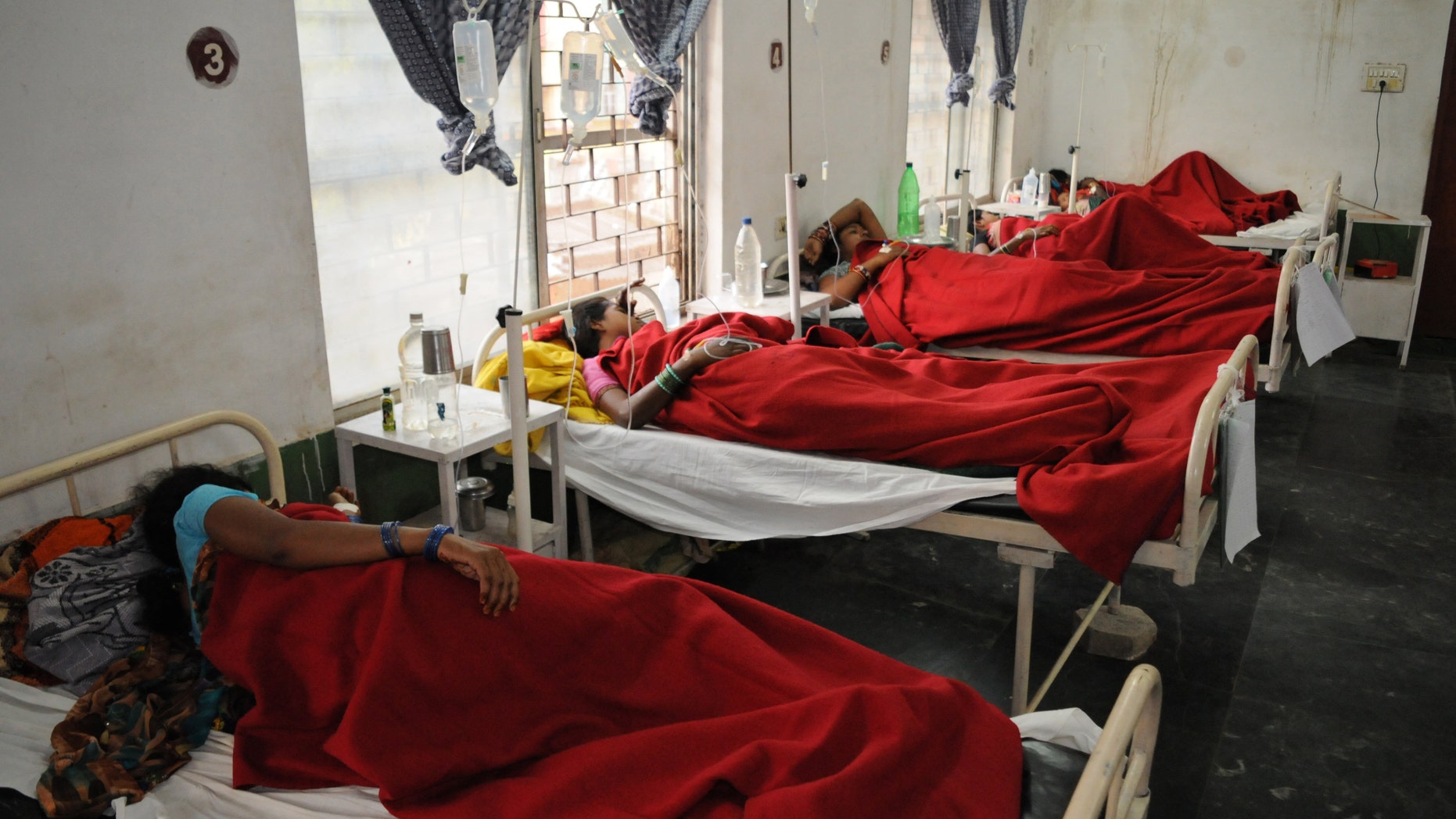 Nov. 12, 2014: Indian women who underwent sterilization surgeries receive treatment at the District Hospital in Bilaspur, in the central Indian state of Chhattisgarh after at least a dozen died and many others fell ill following similar surgery.