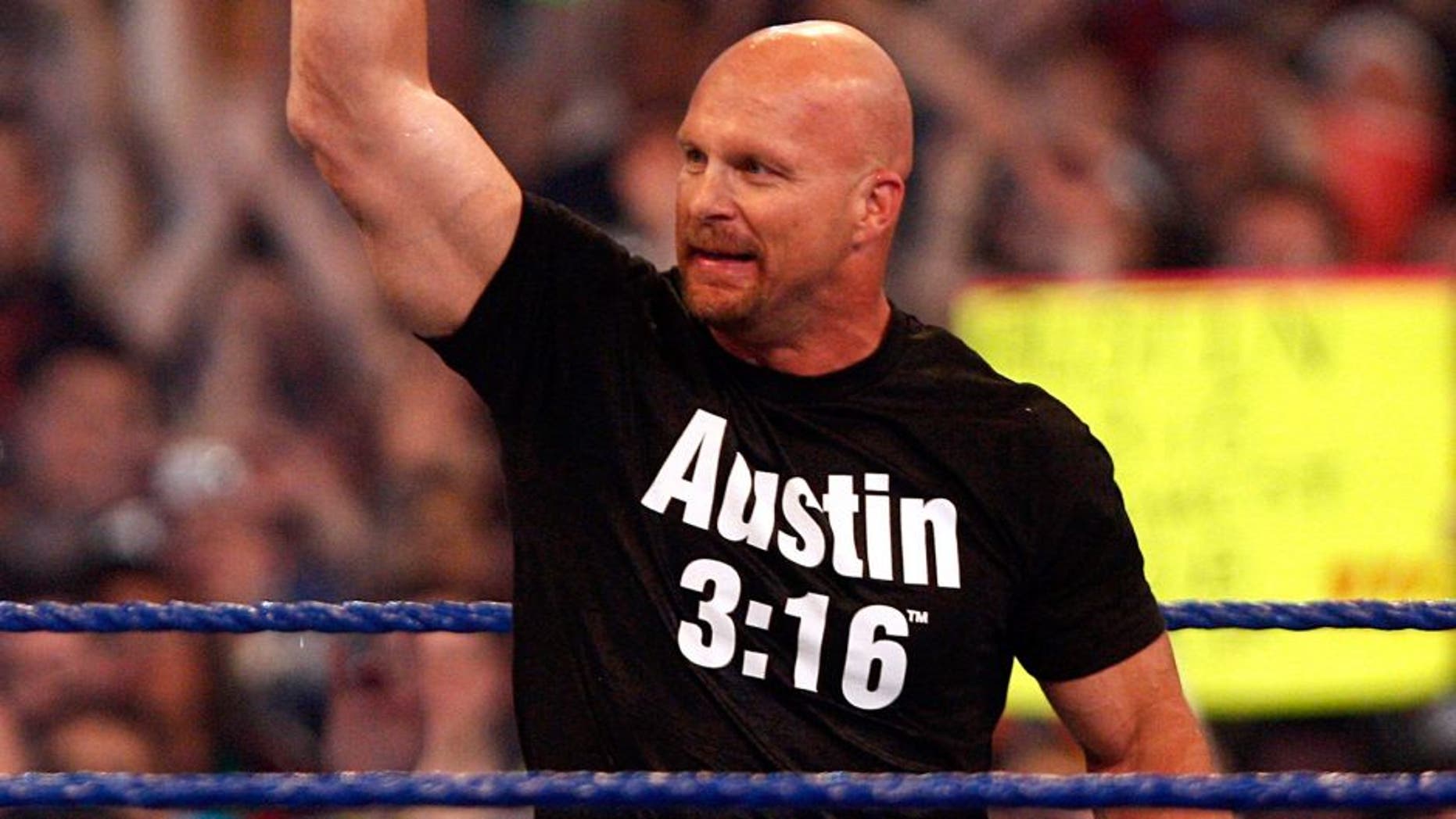 HOUSTON - APRIL 05: Stone Cold Steve Austin salutes the crowd one last time at "WrestleMania 25" at the Reliant Stadium on April 5, 2009 in Houston, Texas. (Photo by Bob Levey/WireImage) *** Local Caption *** Stone Cold Steve Austin