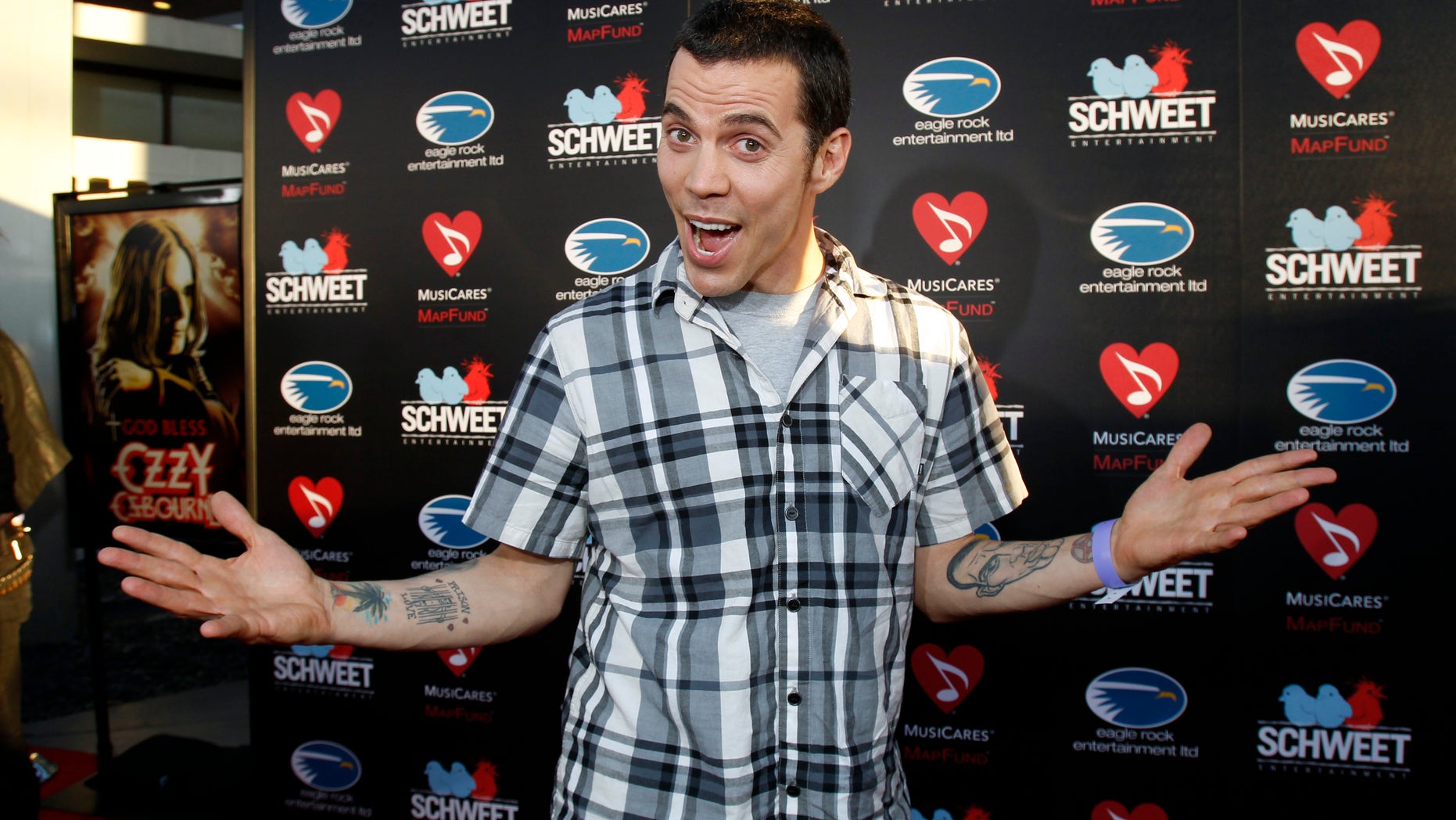 August 22, 2011. Steve-O poses at a private preview of the documentary "God Bless Ozzy Osbourne" at the Arclight Cinerama Dome in Hollywood, California.