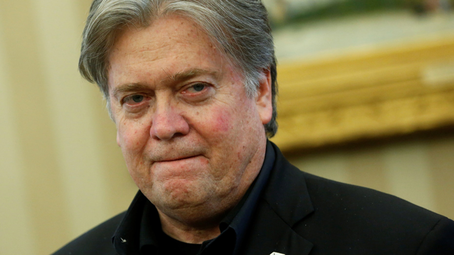 File photo - White House senior advisor Steve Bannon attends as U.S. President Donald Trump signs executive orders in the Oval Office at the White House in Washington, U.S. Jan. 28, 2017. (REUTERS/Jonathan Ernst)
