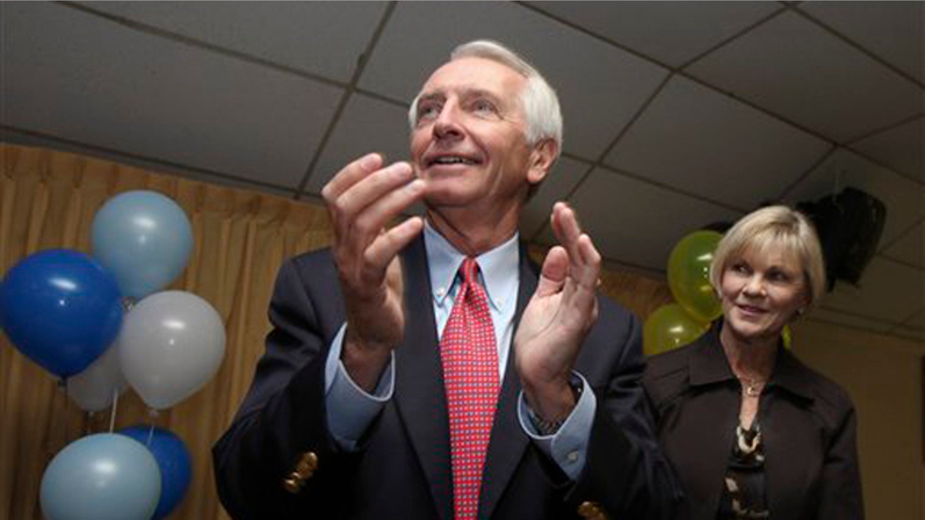 Kentucky Gov. Steve Beshear, left, and his wife Jane watch as Democrats are recognized during a rally at the American Legion Hall on Bardstown Road in Louisville, Ky., Monday, Nov. 7, 2011.