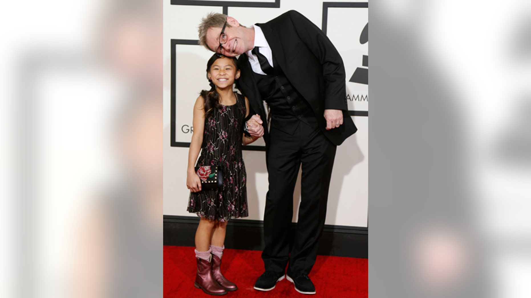 Contemporary Christian artist Steven Curtis Chapman and his daughter arrive at the 56th annual Grammy Awards in Los Angeles, California January 26, 2014.