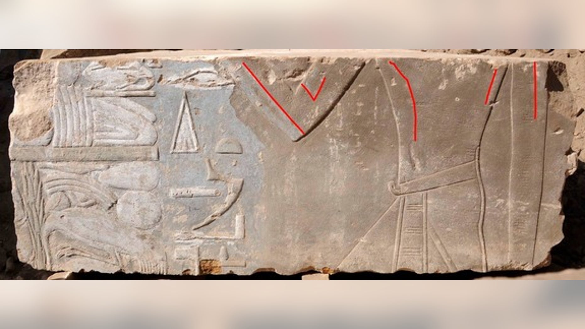 A stone block found on Egypt's Elephantine Island shows Queen Hatshepsut as a female (highlighted by red lines). Later images of the pharaoh portrayed her as a male king.