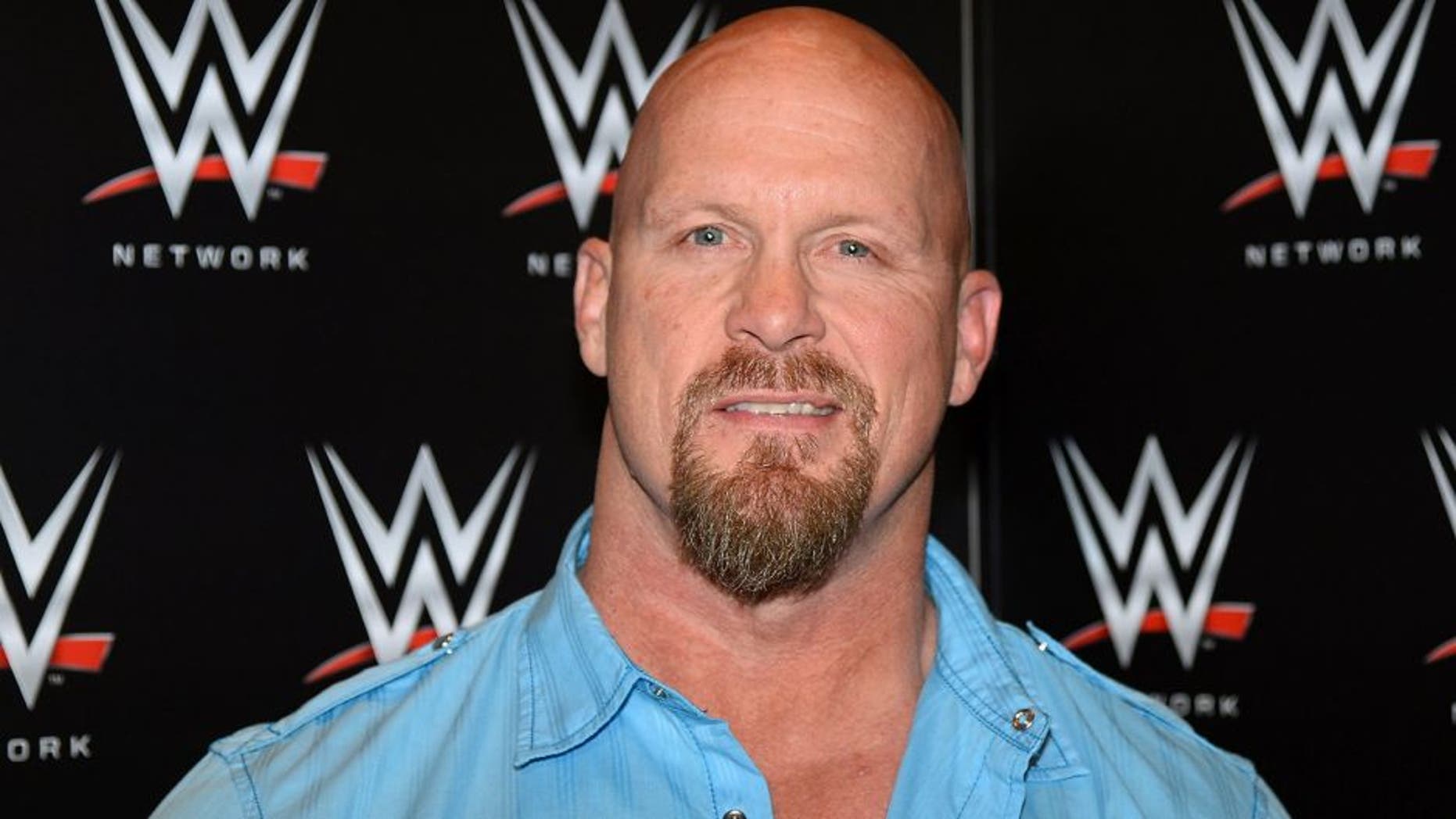 LAS VEGAS, NV - JANUARY 08: Actor and WWE personality "Stone Cold" Steve Austin appears at a news conference announcing the WWE Network at the 2014 International CES at the Encore Theater at Wynn Las Vegas on January 8, 2014 in Las Vegas, Nevada. The network will launch on February 24, 2014 as the first-ever 24/7 streaming network, offering both scheduled programs and video on demand. The USD 9.99 per month subscription will include access to all 12 live WWE pay-per-view events each year. CES, the world's largest annual consumer technology trade show, runs through January 10 and is expected to feature 3,200 exhibitors showing off their latest products and services to about 150,000 attendees. (Photo by Ethan Miller/Getty Images)