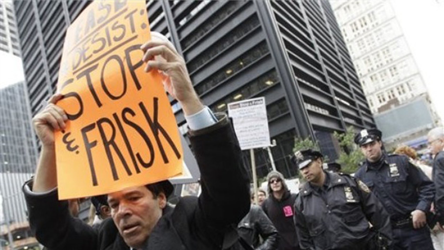 October 2011: New York City police officers follow an anti-stop and frisk march near the former Occupy Wall Street encampment in lower Manhattan. (AP Photo/Mary Altaffer)