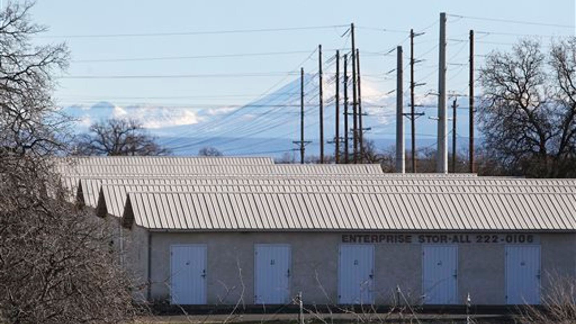 A commercial storage unit facility is shown Tuesday, Dec. 15, 2015, where two children were found dead in Redding, Calif. Autopsies were planned for the 3-year-old girl and 6-year-old boy, whose names were not released. No charges have been filed in their deaths. The investigation began with a call about a possible child abuse case in the small town of Quincy, about 220 miles northeast of San Francisco. (Andreas Fuhrmann/Record Searchlight via AP)