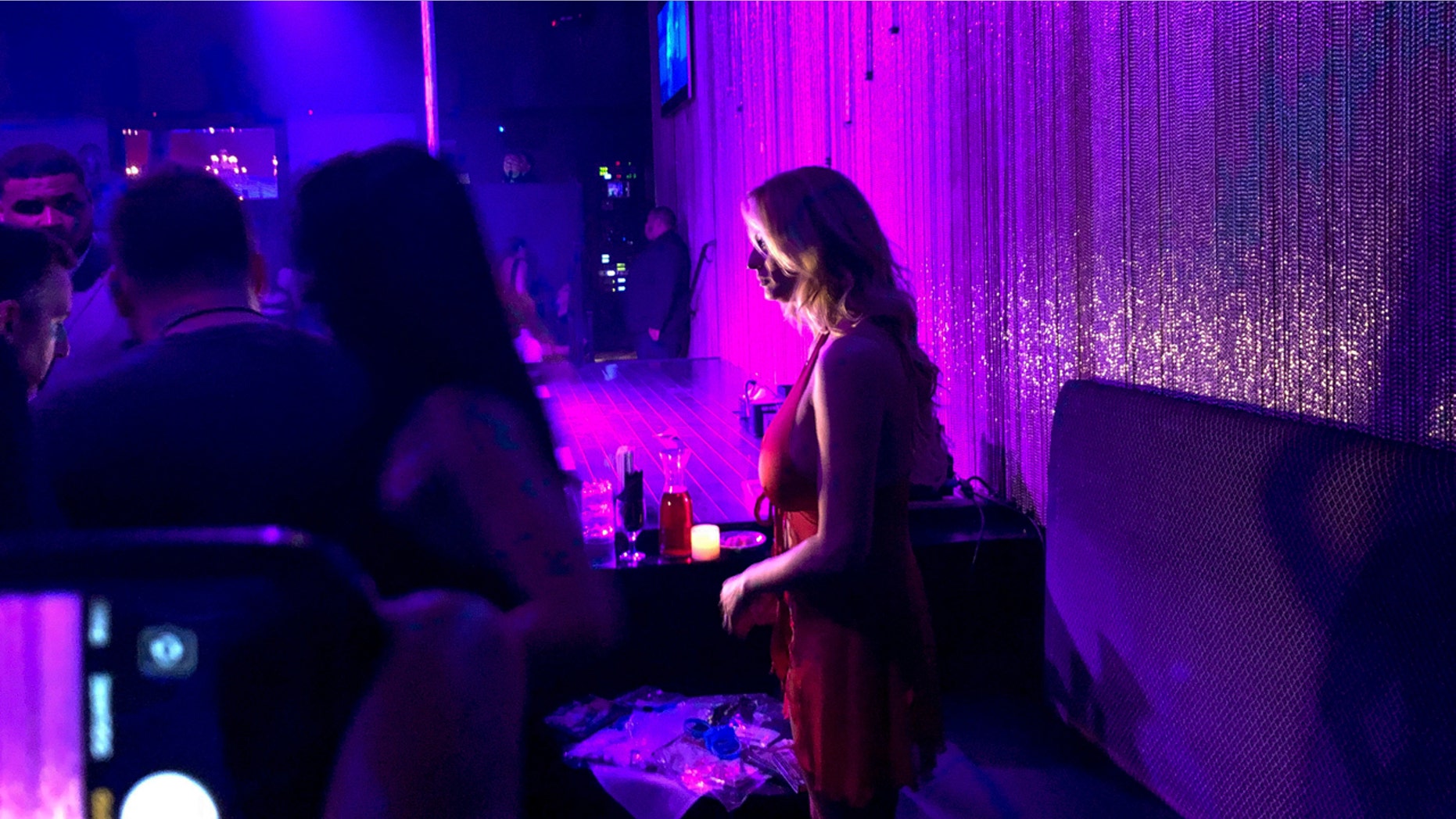 Stormy Daniels holds a meet-and-greet with patrons during her appearance at the strip club Gossip on Saturday, May 5, 2018, in Melville, New York. President Donald Trump suggested Friday that Rudy Giuliani, the aggressive new face of his legal team, needed to "get his facts straight" about the hush money paid to porn actress Daniels just before the 2016 election. The money was paid to Daniels to keep her quiet about her allegations of an affair with Trump. (AP Photo/Kevin Hagen)