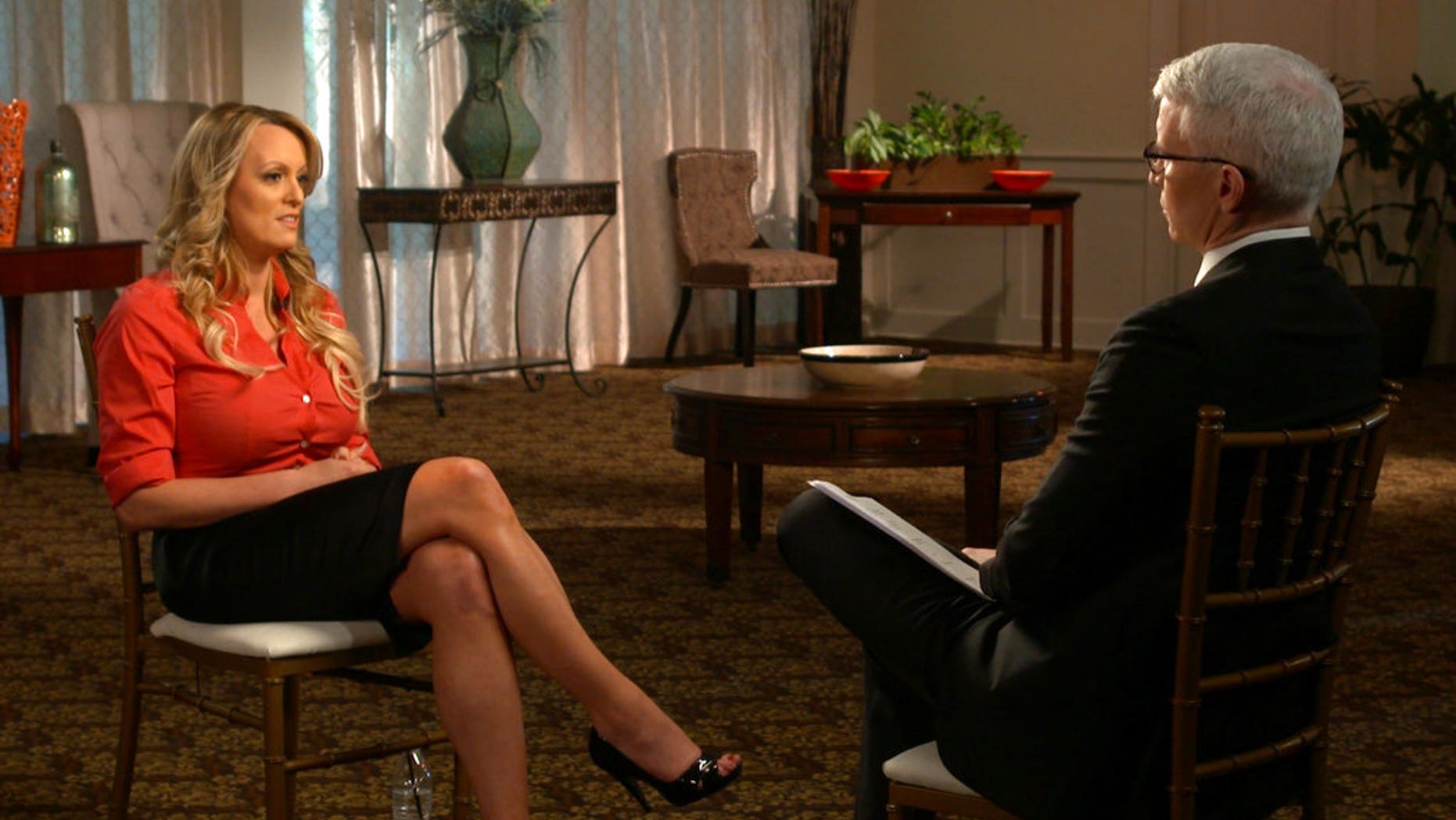 This image released by CBS News shows Stormy Daniels, left, during an interview with Anderson Cooper which will air on Sunday, March 25, 2018, on "60 Minutes." (CBS News/60 Minutes via AP)