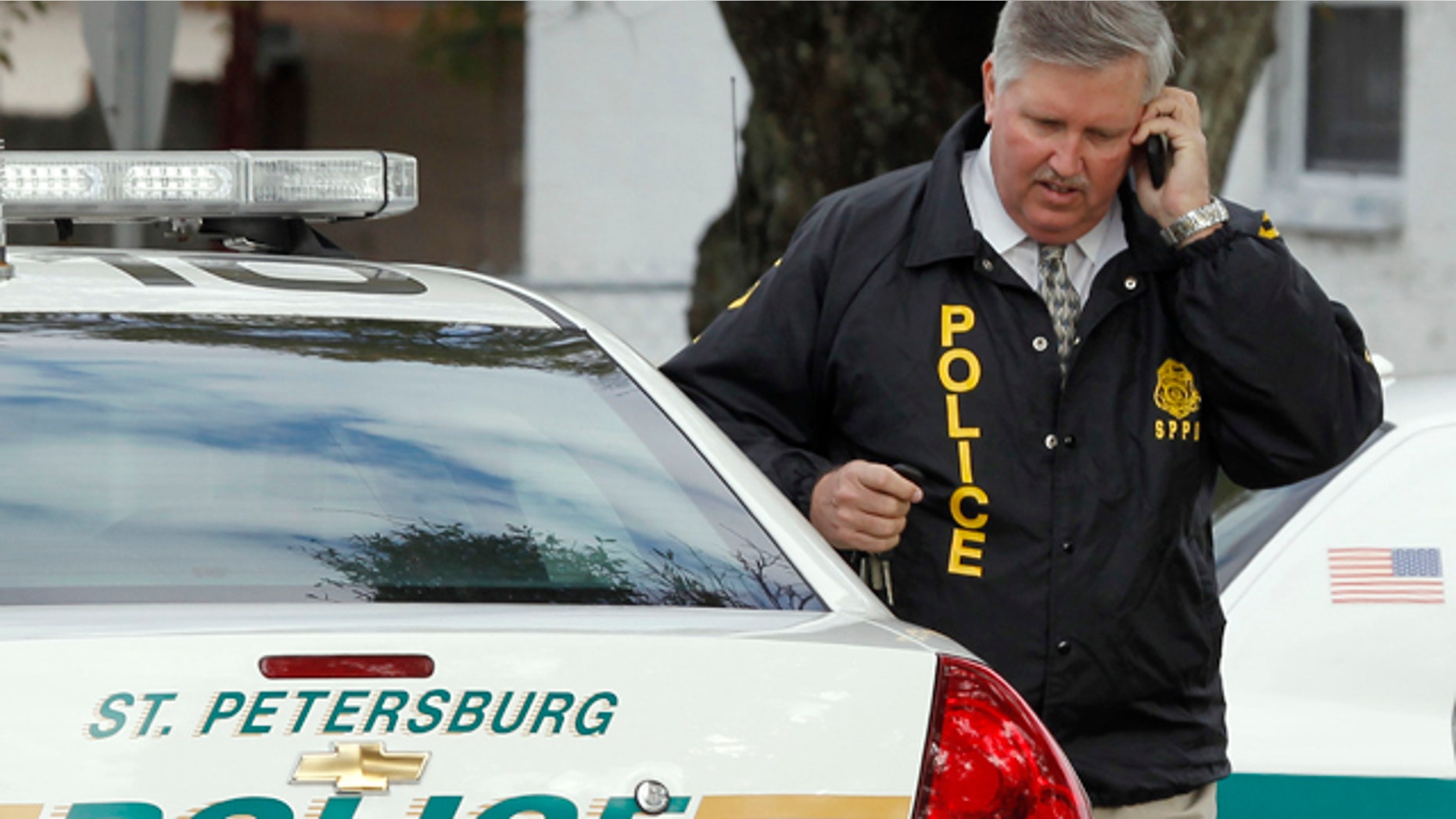 Jan. 24: St. Petersburg Police Chief Chuck Harmon talks on a cell phone as he walks from the scene where a U.S. Marshal and two St. Petersburg police officers were shot while trying to serve an arrest warrant in St. Petersburg, Fla. (AP)