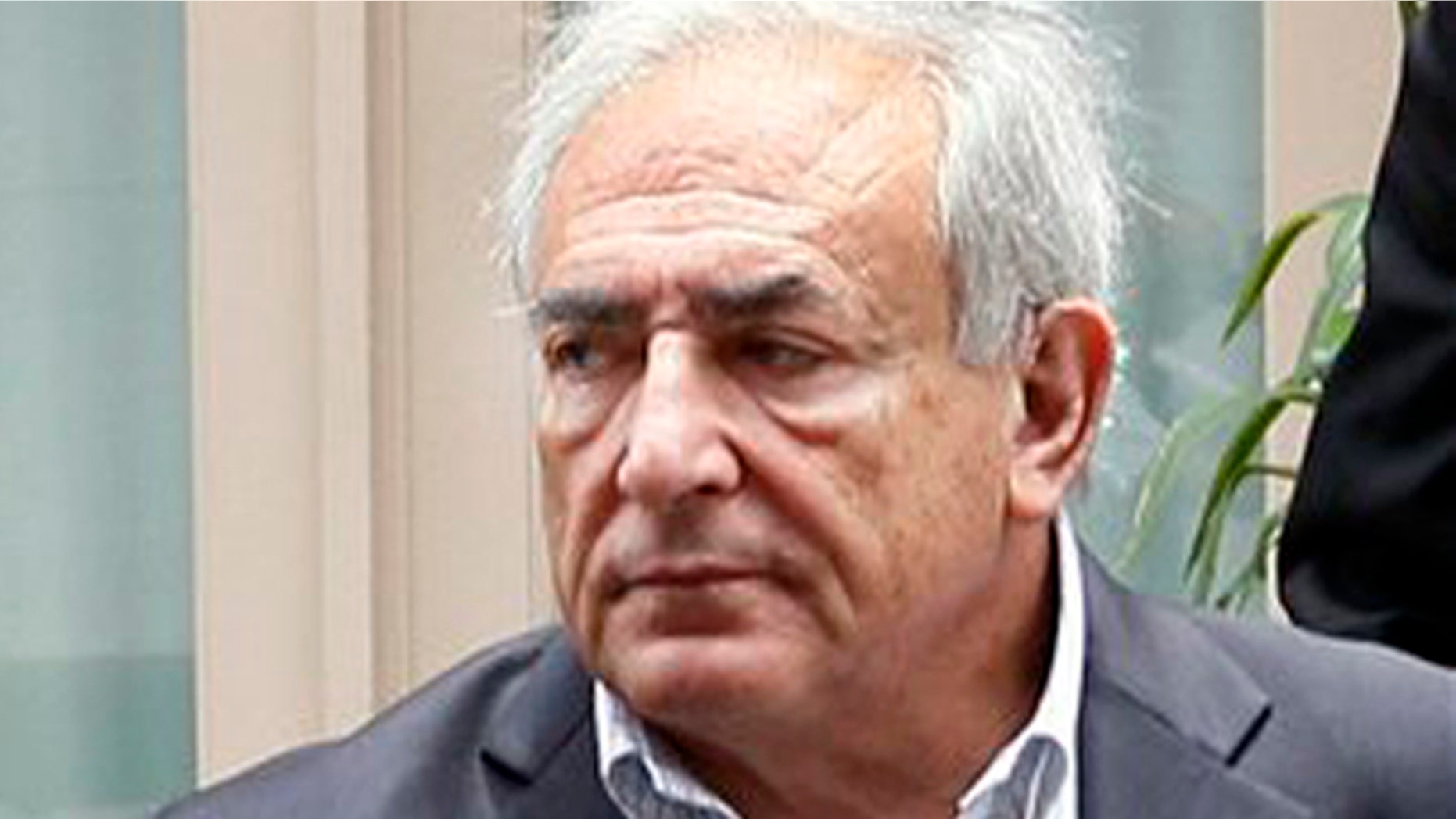 Former International Monetary Fund leader Dominique Strauss-Kahn leaves his Tribeca home with his wife Anne Sinclair, Wednesday, July 13, 2011 in New York.