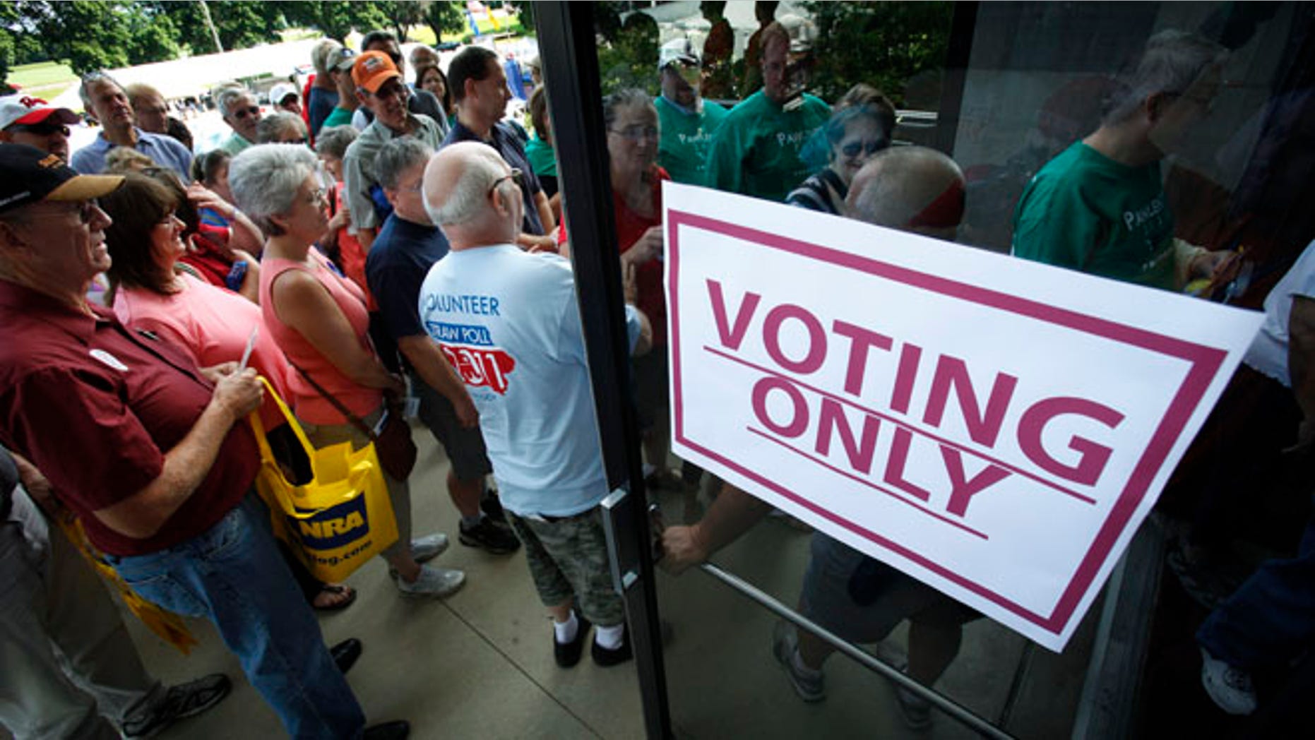 FILE: Aug. 13, 2011: Republicans enter Hilton Coliseum before casting their ballots in the Iowa Republican Part's straw poll, in Ames, Iowa.