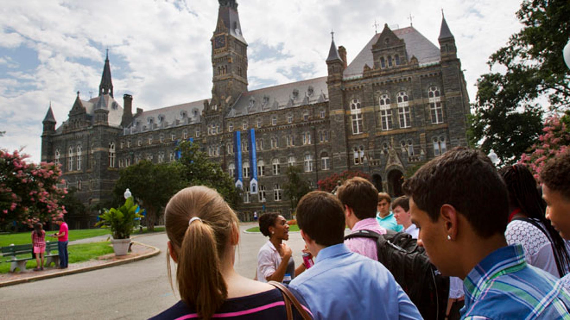 Prospective students tour Georgetown University's campus in Washington, in this Wednesday, July 10, 2013, file photo. Grants and scholarships are taking a leading role in paying college bills, surpassing the traditional role parents long have played in helping foot the bills, according to a report from loan giant Sallie Mae.
