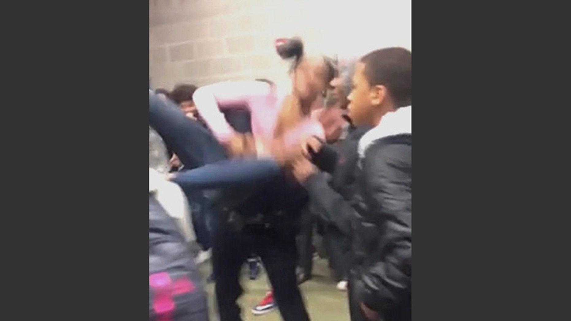 In this Tuesday, Jan. 3, 2017, image made from video and released by Pam C. Akpuda, officer Ruben De Los Santos of the Rolesville Police Department slams a teenage girl to the floor in Rolesville, N.C.