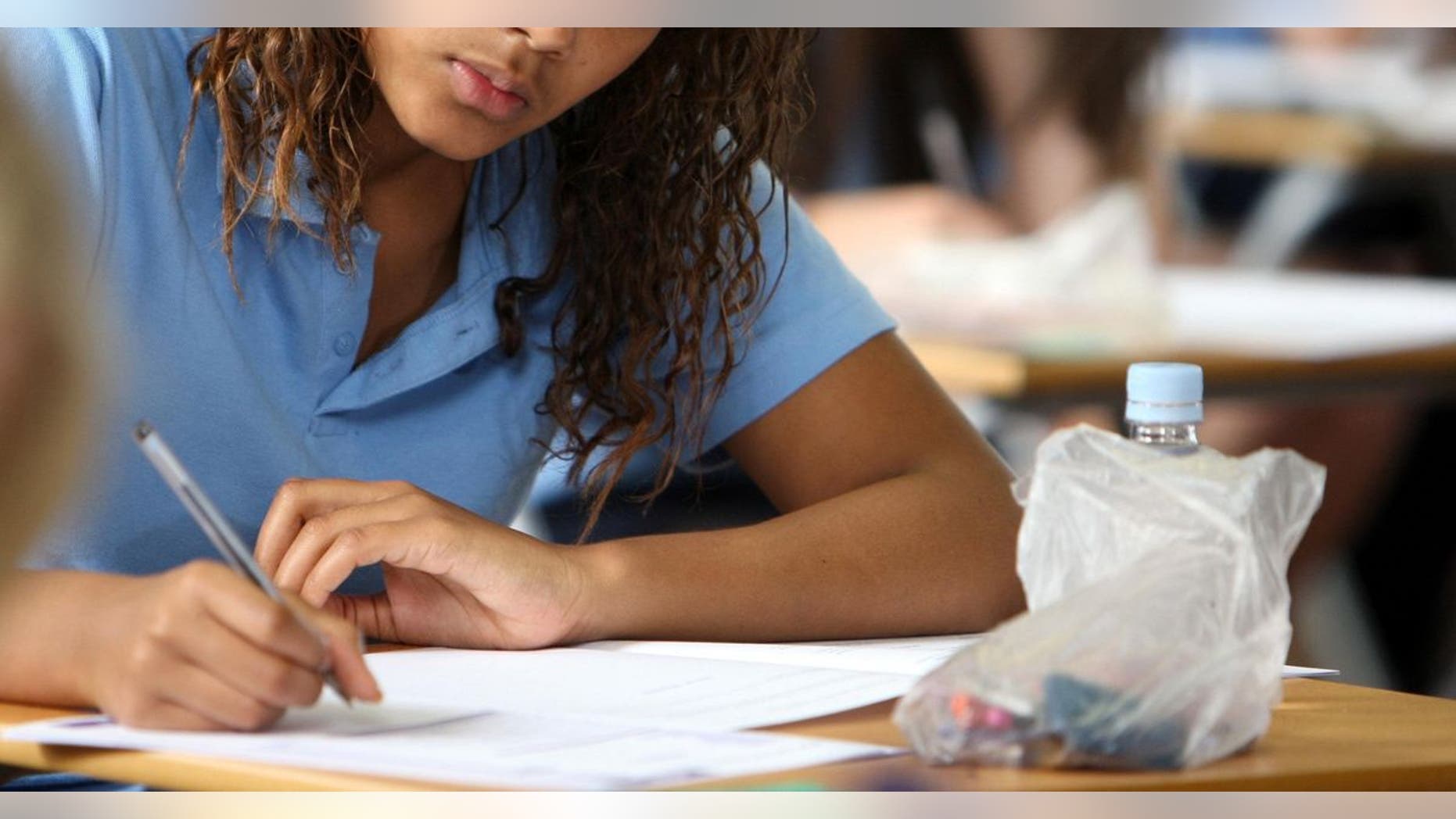 Along with bills and junk mail, your middle or high-school student’s first-quarter grades may be arriving soon at a dinner table near you. (Chris Radburn/PA Wire, Press Association via AP Images)